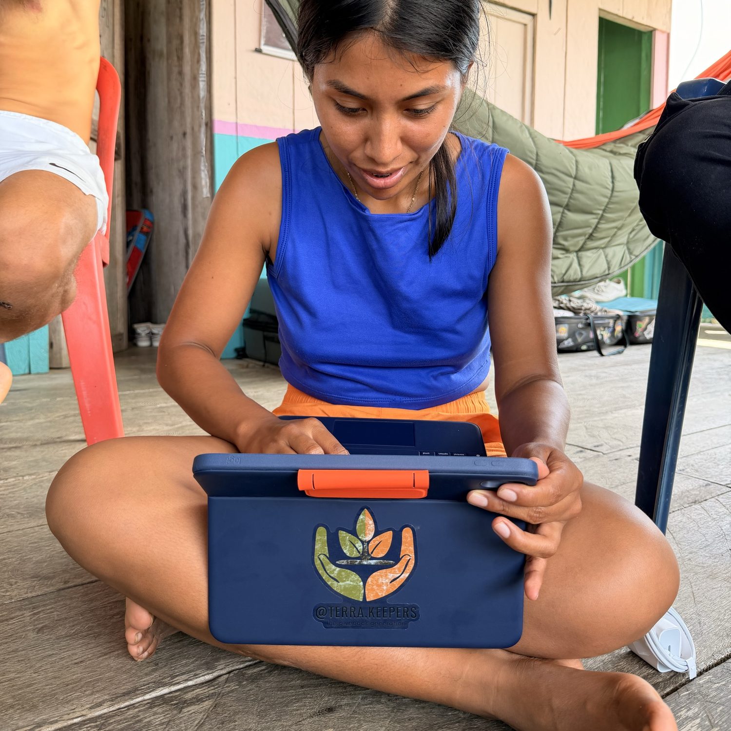 A young woman in El Diviso working on a TerraKeepers education tablet